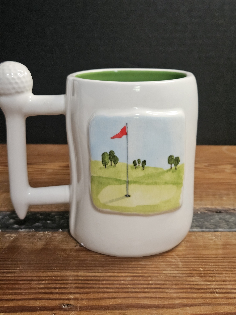 Rae Dunn White Mug with Green Interior and Red Flag Golf Design